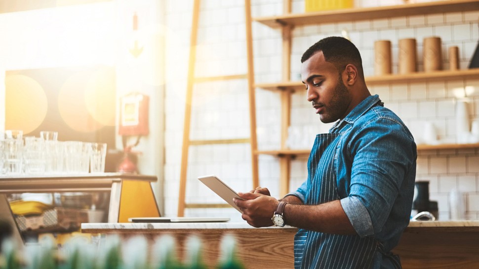 Happy business owner using SavPay